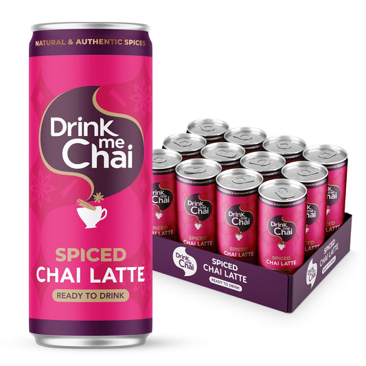 Pink can of Drink me Chai Spiced Chai Latte with a box of similar cans on a white background