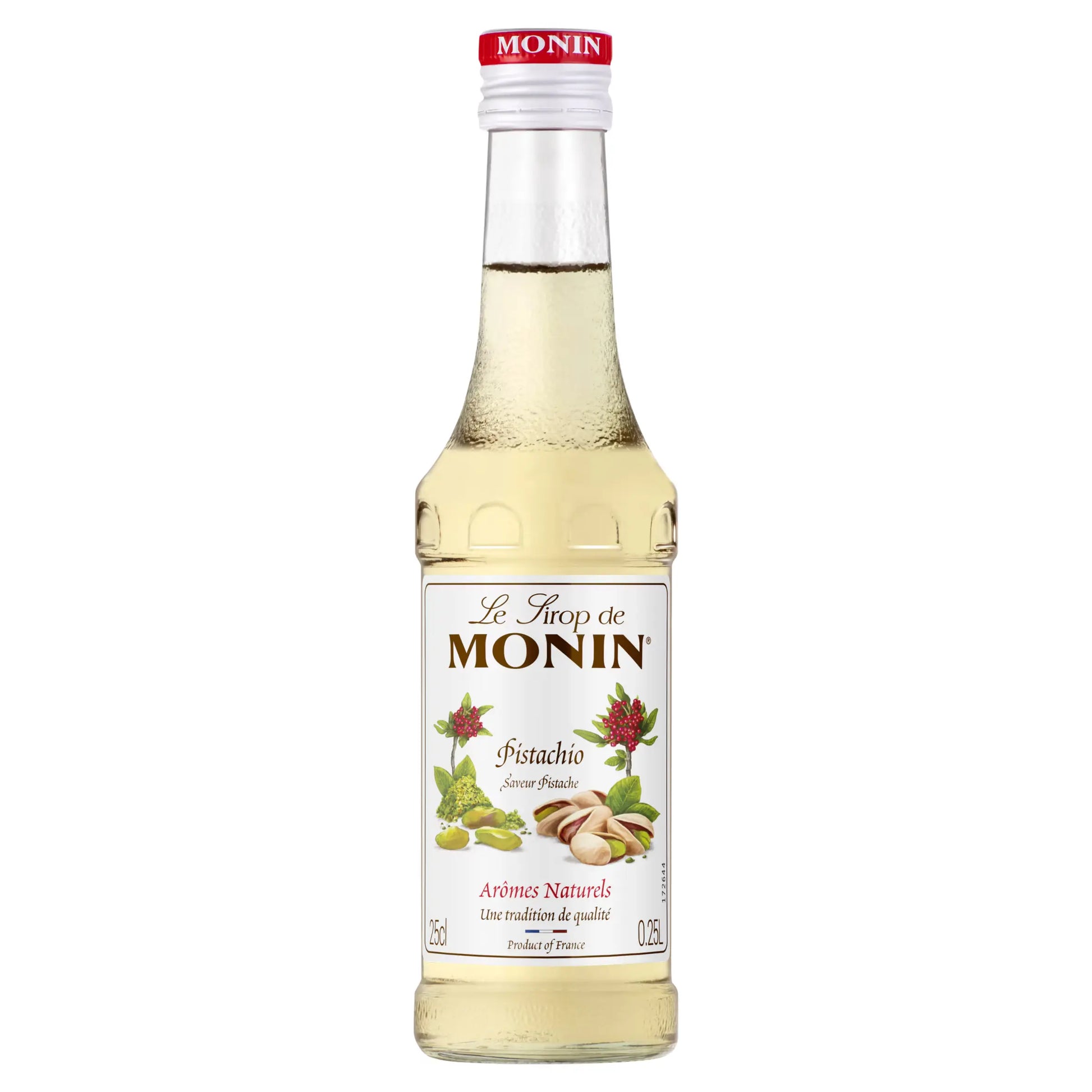 Monin pistachio syrup bottle close up with red cap and label showing pistachio nuts illustration for coffee syrups