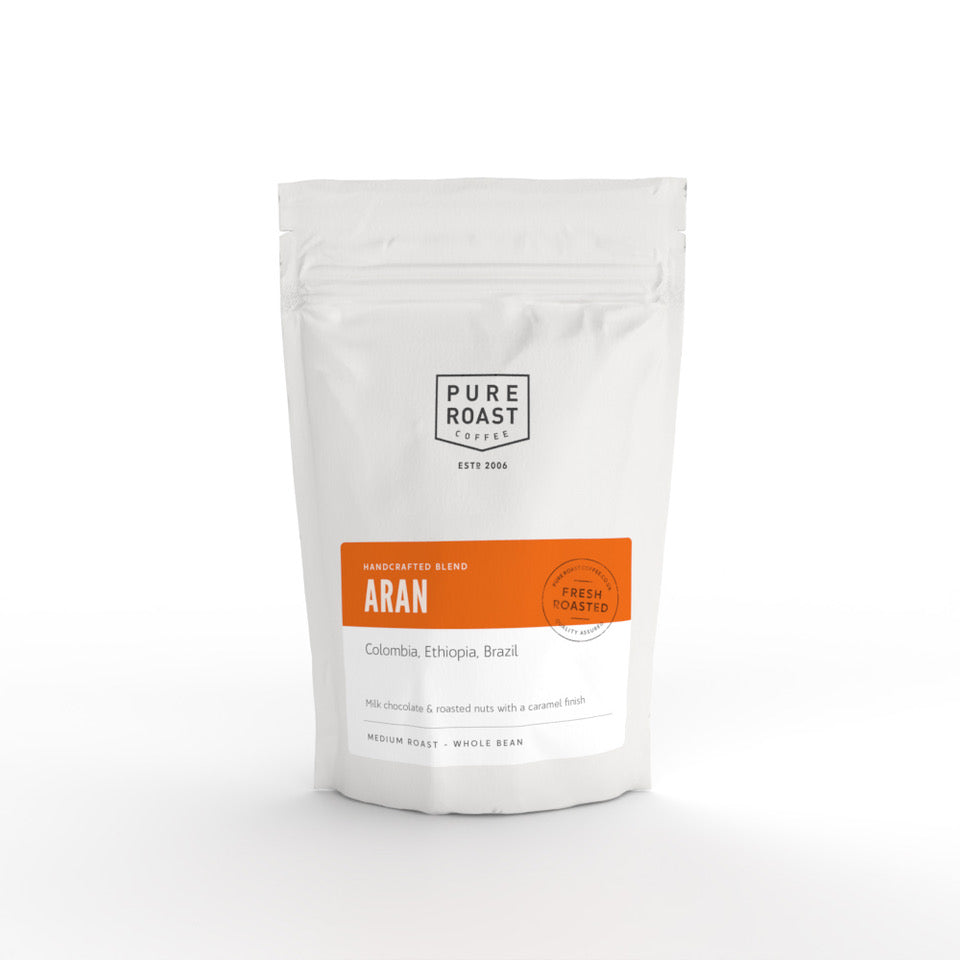 A packaged bag of Aran blend coffee beans from Pure Roast with branding and product information displayed on the front.